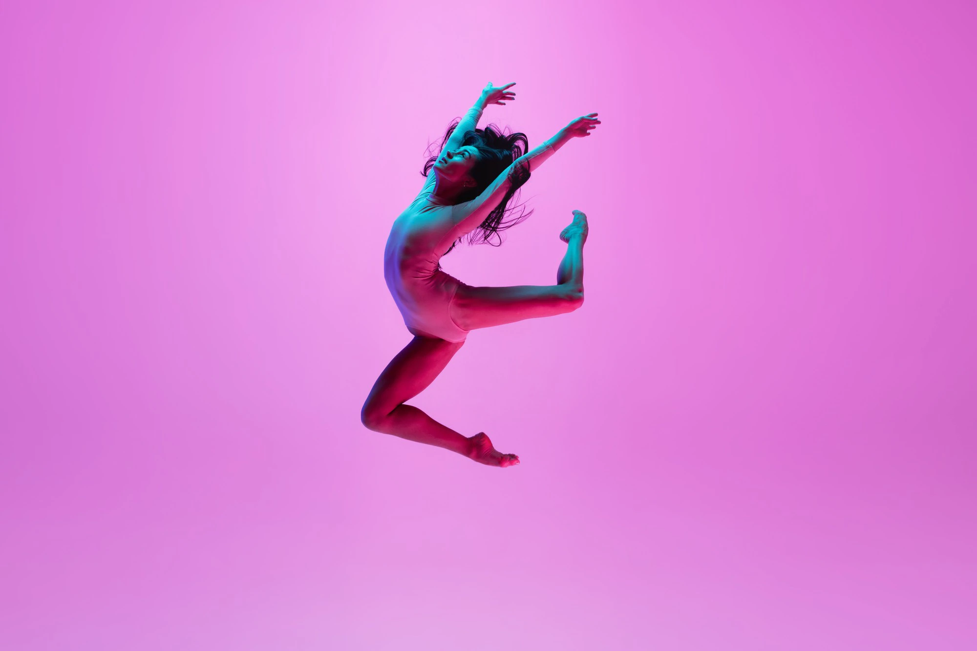 young girl jumping on pink wall 155003 26349