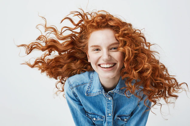portrait beautiful cheerful redhead woman with flying curly hair smiling laughing 176420 14462