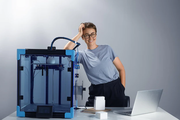 caucasian beautiful lady glasses smiling near 3d printing machine her office new technologies small businesses concept computer prototypes table tech ambient jpg photo 633478 537 1