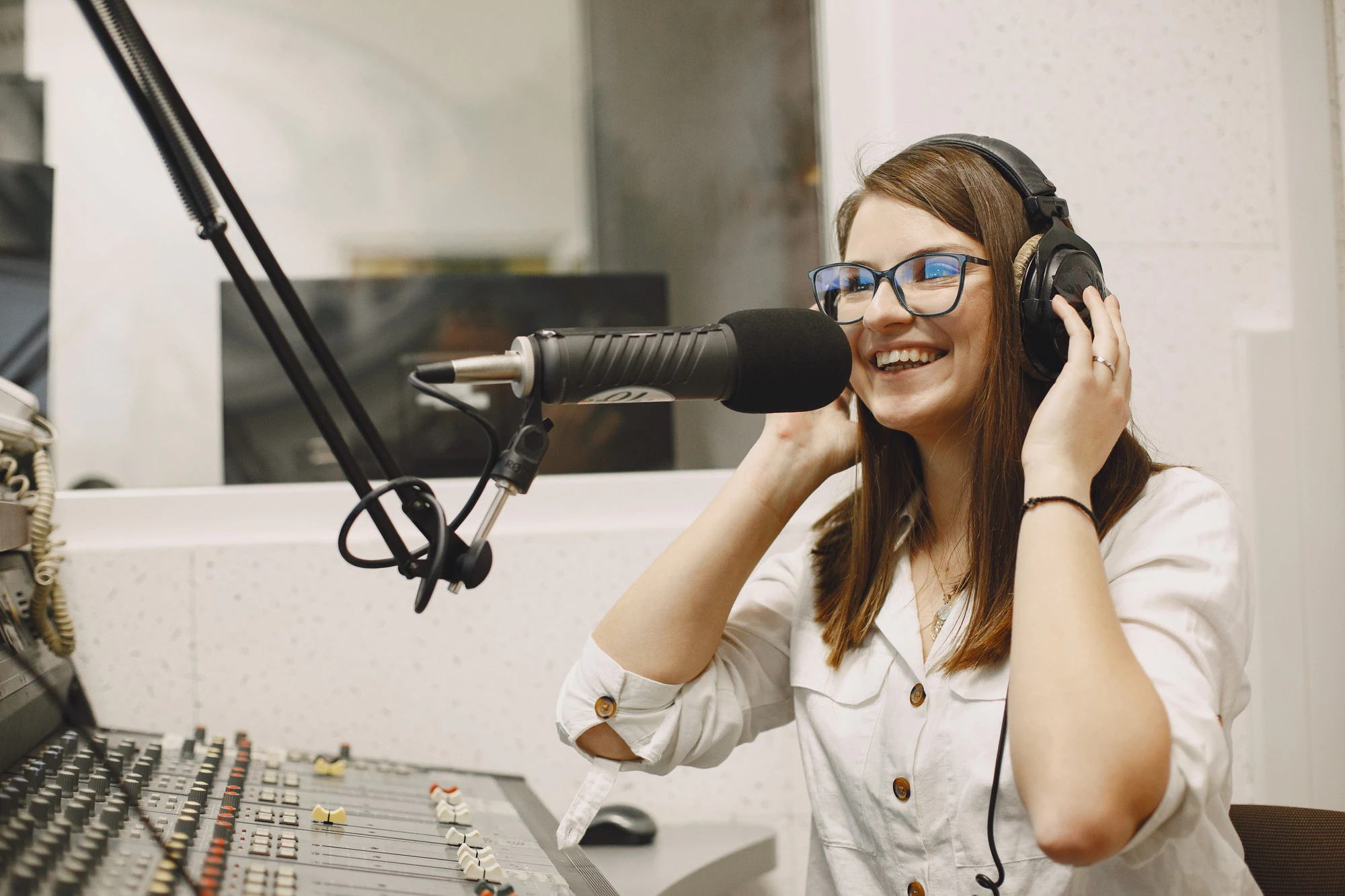 female host communicating microphone woman radio studio 1157 47587