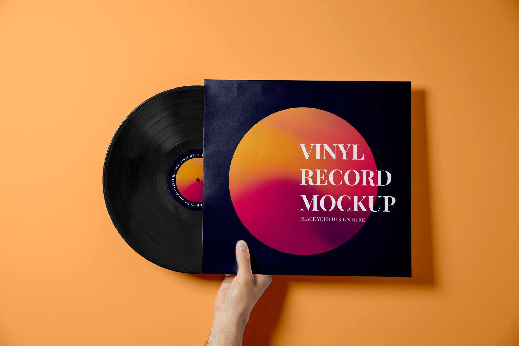hand holding vinyl record with orange background 23 2149379020