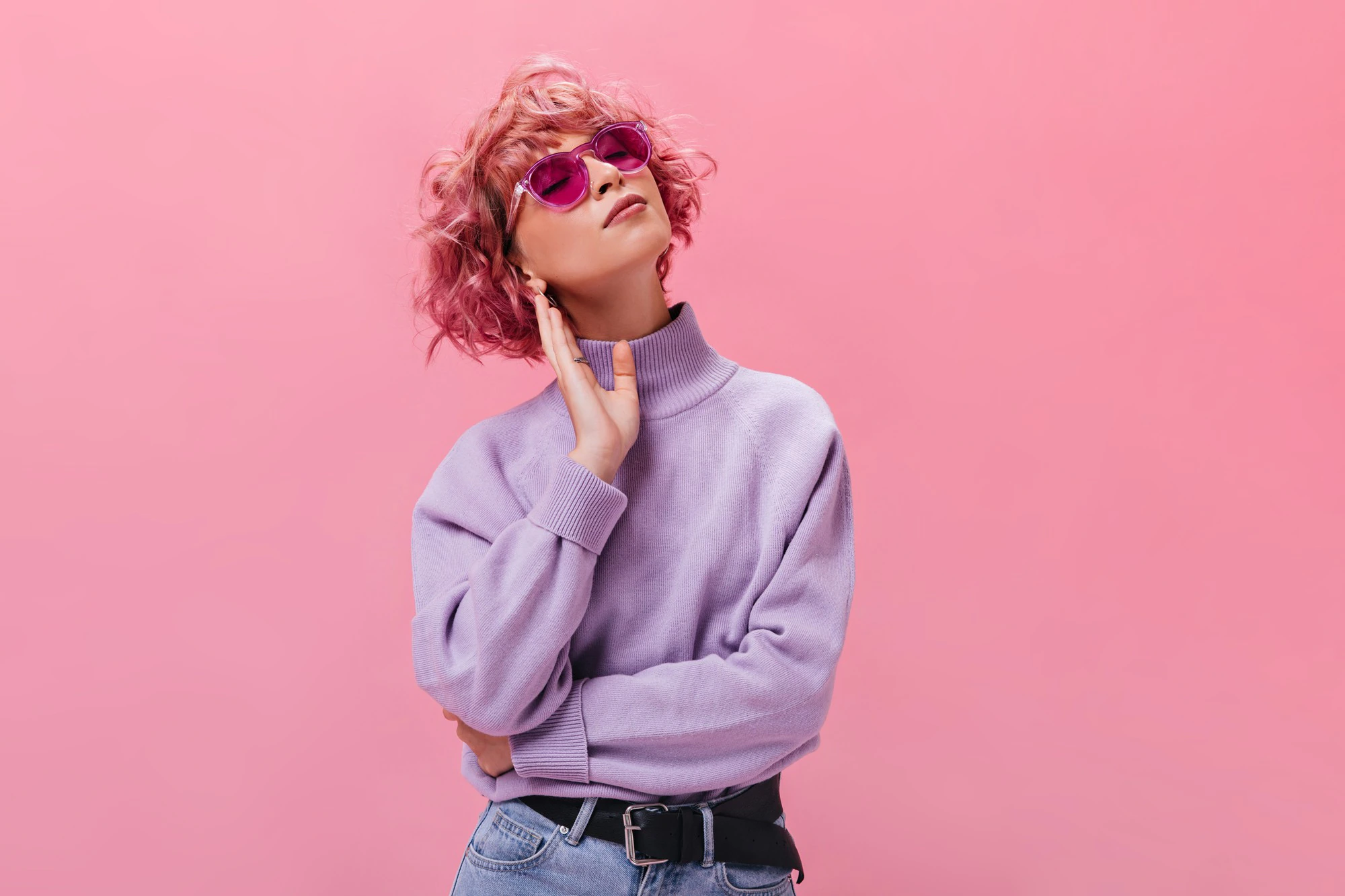 attractive curly woman purple cashmere sweater fuchsia sunglasses poses isolated wall 197531 24158